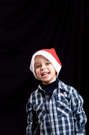 Portrait of happy boy in Santa Claus hatのeditorial素材