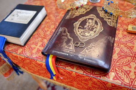 Wedding rings on prayer book in Orthodox churchのeditorial素材