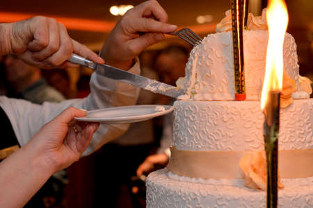 bride and groom cutting their wedding cake, detailの写真素材