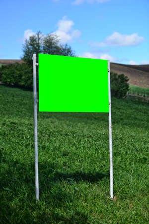 Big blank and green billboard in the nature. Copy spaceの写真素材