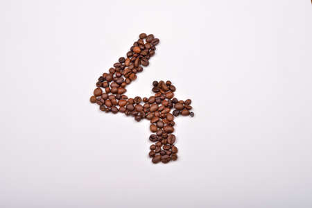 Number four from coffee beans isolated on white background. Love coffee. Morning pleasureの写真素材