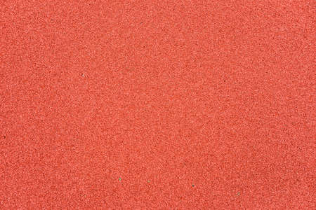 Red rubber floor on playground. Background detailの写真素材