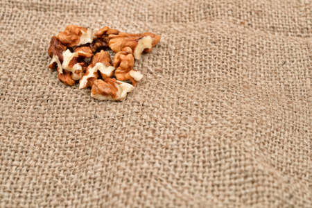 Walnuts on jute background. Healthy food. Selective focus. Copy spaceの写真素材