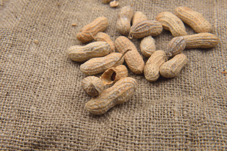 Peanut in the shell on a jute background. Healthy food