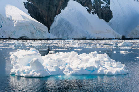 Awesome iceberg drifting in Antarctic watersの写真素材
