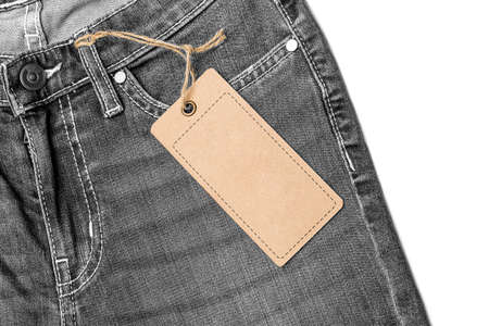 Label price tag mockup on blue jeans from recycled paper.の写真素材