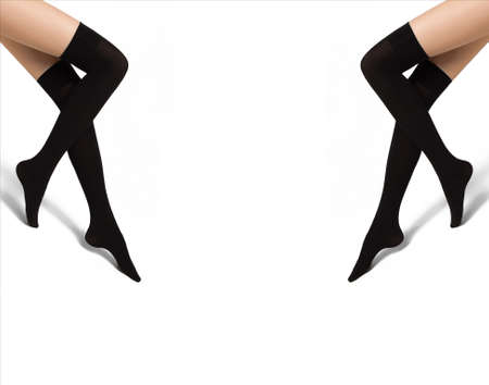 Sexy female legs in fishnet stockings isolated over white backgroundの写真素材