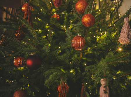 Christmas and New Year decorated interior room. Festive Xmas night with lights on tree with presents