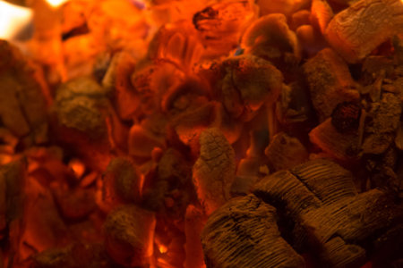 Coal glowing in the fireplace soft focus background