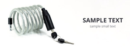 Silver bike and bicycle cable lock with key isolated on white background. Wide mockup for copy...