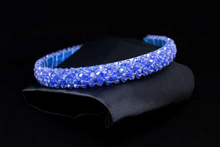 Blue sapphire tiara gemstones diamonds hair band on black background. Jewelry display isolated conceptの写真素材