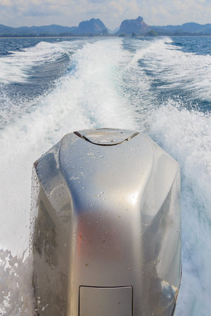 Speed boat's engines leaving from the island