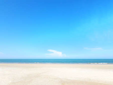 Empty sea and beach on blue sky backgroundの写真素材