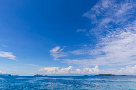 Blue sky with white cloud  and deep blue seaの写真素材