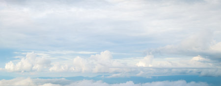 Beautiful blue sky with white fluffy clouds.の写真素材