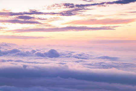 View at sunrise with puffy foggy. White puffy like cloud stretching to foggy horizon in the bright morning.の写真素材