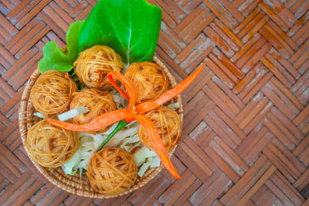 Deep fried wrapped pork with noodle. Traditional thai food as known as Mhoo Sarong.の写真素材