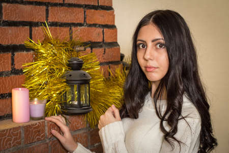 Girl near the fireplaceの写真素材