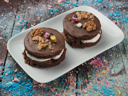 Chocolate cake sprinkled with nuts in a plate on the table