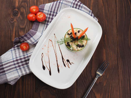 Vegetable salad with mayonnaise on a plate, rustic background. Top view.の写真素材