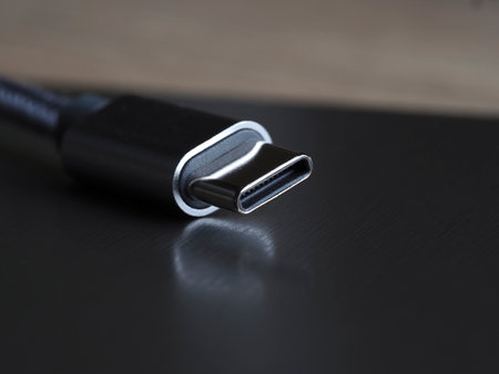 USB cable on a black background. Close-up. Selective focus.の写真素材