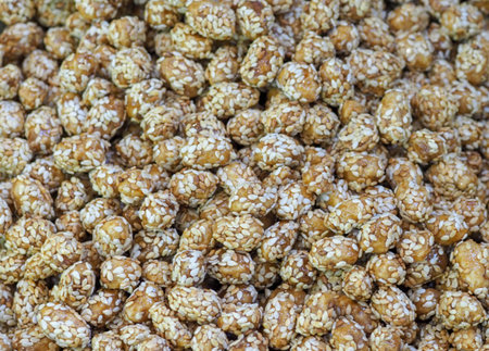 Eastern Delights: Sesame Coated Peanuts on a Store Counter, an Invitation to Taste