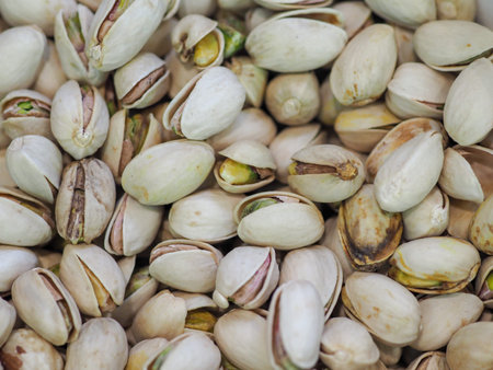 Close-Up of Unshelled Pistachios: A Symbol of Natural Energy and Festive Mood