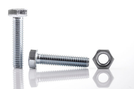 Screws and nut isolated on whiteの写真素材