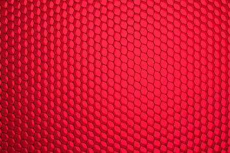 Honeycomb grid against red backgroundの写真素材