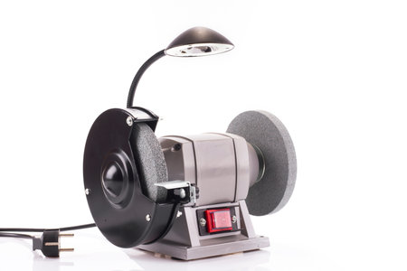 Bench grinder with lamp isolated on white background