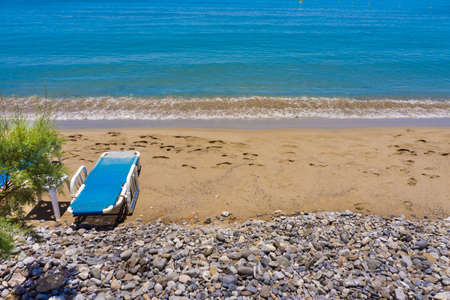 Sand and pebble beach coastlineの写真素材