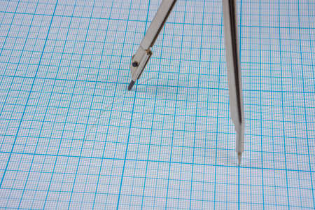 Drawing circle with compasses on graph paperの写真素材