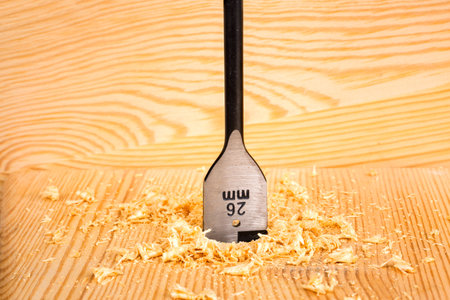 Drilling wood with flat bit