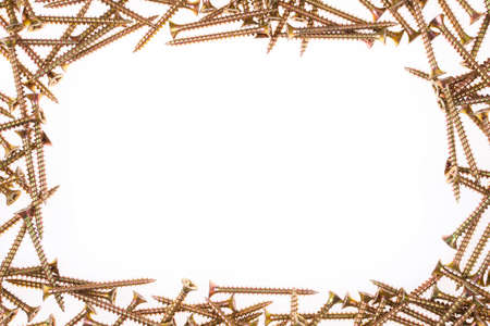 Yellow screws as frame on white backgroundの写真素材