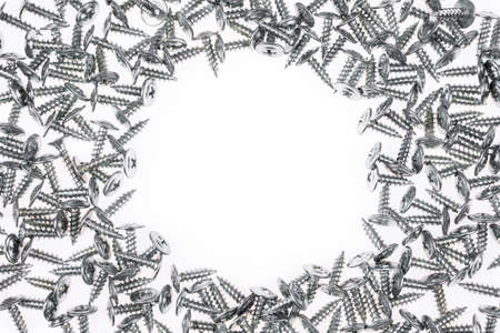 Silver screws around white backgroundの写真素材