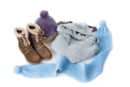Set of women's winter clothes on whiteの写真素材