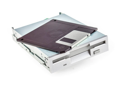 Floppy disk drive and diskette isolated on white