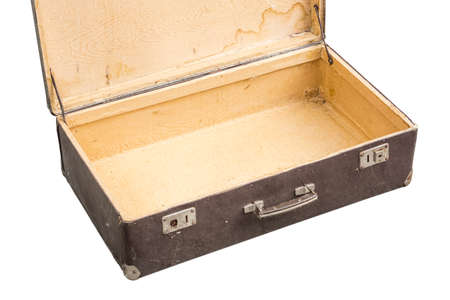 Old opened suitcase isolated on whiteの写真素材