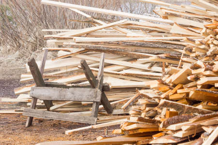 Sawbuck on pile of firewood backgroundの写真素材