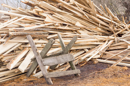 Sawbuck on pile of firewood background