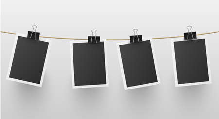 Set of retro blank photo frames hanged on rope attached with paper clip vector retro memory snapshotのイラスト素材