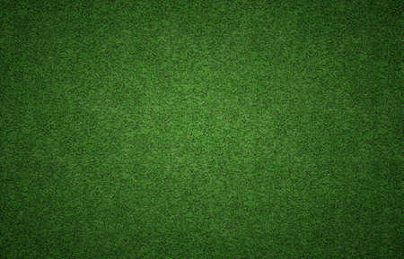 Green grass background texture with grunge lighting and lots of copy space. Perfect for sport designs