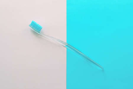 Toothbrush On The Pastel Background Light Pink Blue Colors Mimimal Style Top View Flat Lay Open Space for Textの写真素材