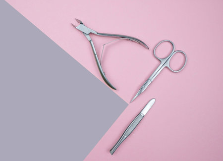 Composition With Manicure Tools. Scissors For Nails, Tweezers, Forceps On The Geometric Pastel Pink...