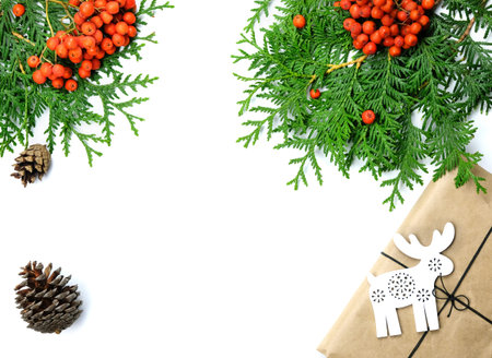 Pine Cones, Red Berries, Spruce Branches. Christmas and New Year's Decor Gift Box With Toy Deer....