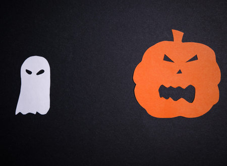 Scary Ghost And Orange Pumpkin On Black Background. Minimal Flat Lay Top View. Creative Halloween...