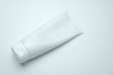 White Cosmetic Tube Pack Of Cream, Gel Or Lotion On The Light Background. Minimal Style Flat Lay With Space For Text. Branding Mock-up Concept Of Beauty Productの写真素材