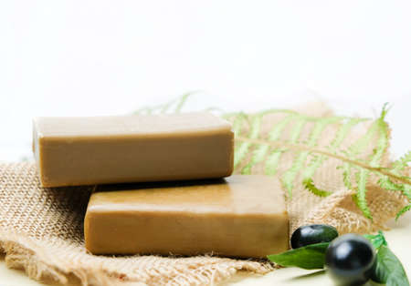 Natural Handmade Olive Soap On The Burlap With Olive Branch. Natural Cosmetics. White Background With Space For Text.の写真素材