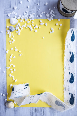 Light Yellow Blank White Natural Objects Seashells Stones Frame Of Cotton Ribbon With Whale Wooden Background Concept of Marine Sea Summer Vacation Open Space For Text Verticalの写真素材