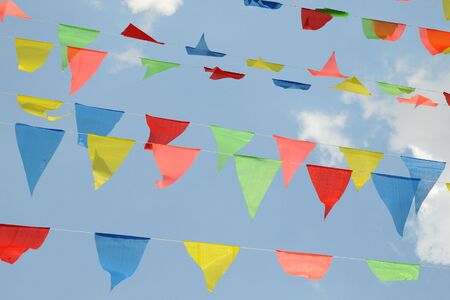 Triangular Colored Flags Fluttering の写真素材